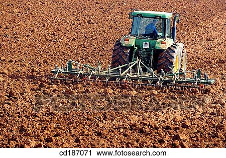 Tractor with sower View Large Photo Image Stock Image - Tractor with sower. Fotosearch