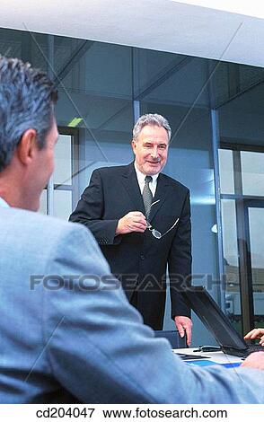 Stock Photo - Two executives in conference. Fotosearch