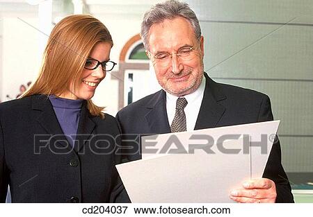 Two executives with files View Large Photo Image Stock Photo - Two executives with files. Fotosearch