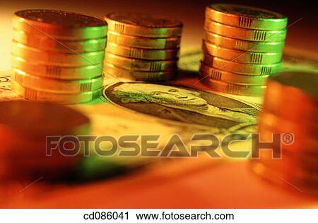 Stock Image - U. S. Dollars and coins. Fotosearch
