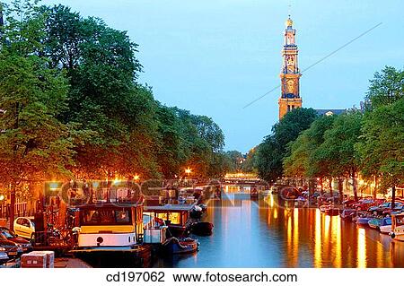 Stock Image - View down Prinsengacht to Westerkerk at night. Amsterdam. Holland. Fotosearch