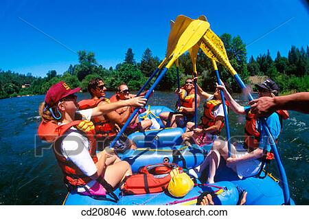 Stock Photograph - White water rafting, team paddle slap. Fotosearch