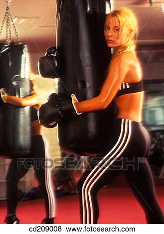 Woman boxer in a boxing gym View Large Photo Image Stock Photo - Woman boxer in a boxing gym. Fotosearch