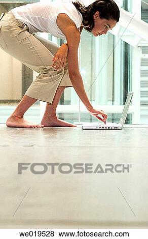 Stock Photo - 30's, businesspeople, business, barefoot, 20's. Fotosearch