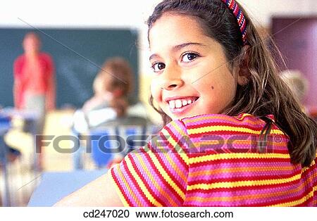 Stock Image - absent-mindedness, classroom, child, brunette, Absent-minded. Fotosearch