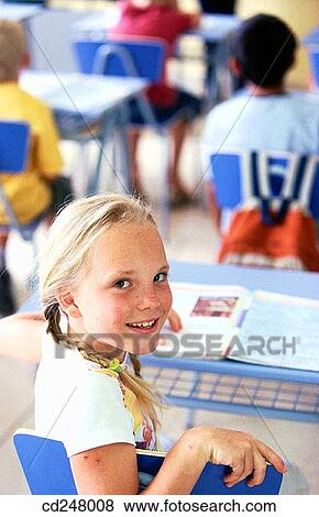 Stock Photo - absent-mindedness, classroom, child, blond, Absent-minded. Fotosearch