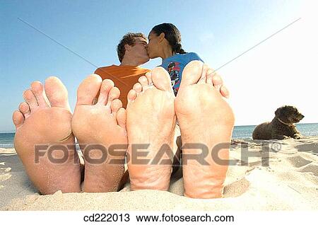 Stock Image - animal, brunette, blond, beach, 20's. Fotosearch