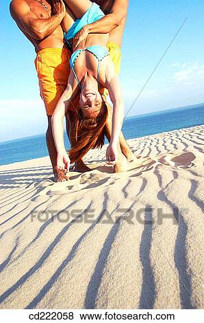 Stock Photo - anonymous, blue, beach, bathing-suit, amusement. Fotosearch