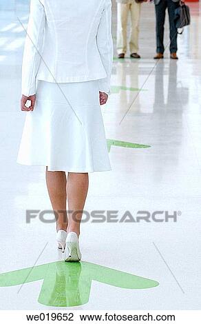 Stock Image - anonymous, business, back view, arrow, advance. Fotosearch