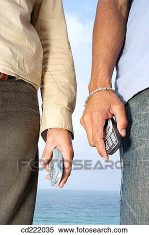 Stock Photography - arm, contemporary, communication, cell phone, anonymous. Fotosearch