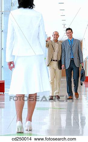 Picture - back view, business, businessman, businesspeople, businesswoman. Fotosearch