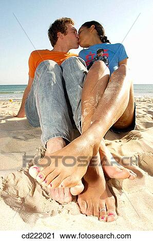 Stock Image - beach, brunette, blond, 20's. Fotosearch