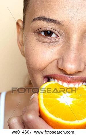 bite, biting, brunette, Close-up View Large Photo Image Stock Photo - bite, biting, brunette, Close-up. Fotosearch