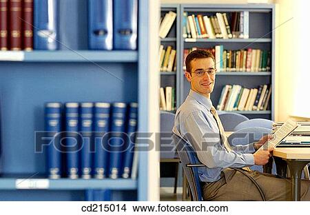 black hair, book, bookcase, business, businessman, businesspeople View Large Photo Image Picture - black hair, book, bookcase, business, businessman, businesspeople. Fotosearch