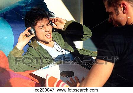 Stock Photo - black hair, boy, adolescence. Fotosearch
