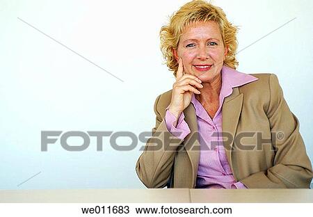 Stock Image - blond, blue eyes, business, businesspeople, businesswoman. Fotosearch