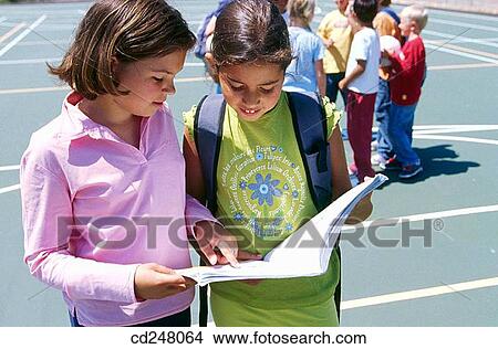 blond, book, brunette, child, childhood View Large Photo Image Picture - blond, book, brunette, child, childhood. Fotosearch