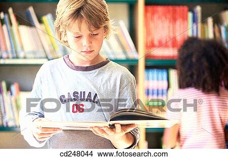 blond, book, child, childhood View Large Photo Image Picture - blond, book, child, childhood. Fotosearch