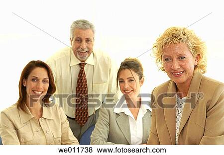 Stock Photo - blond, business, brunette, 30's. Fotosearch