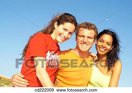Stock Photo - blue, colleague, blue sky, 20's. Fotosearch