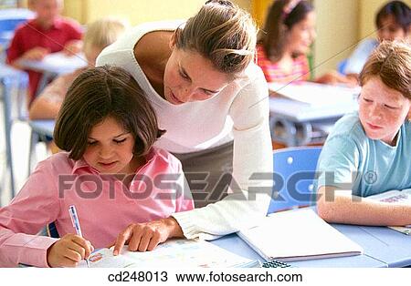 Stock Image - book, boy, child, classroom. Fotosearch