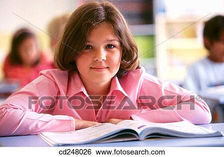 Stock Photograph - book, brunette, child, classroom. Fotosearch