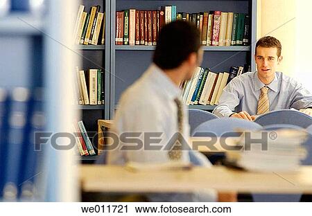 Stock Image - book, businessman, business, bookcase, 20's. Fotosearch