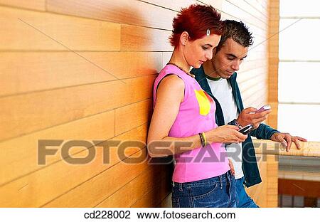 Stock Image - boy, cell phone, adolescence. Fotosearch