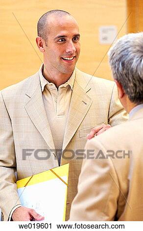 Stock Image - business, businesspeople, businessman, 30's. Fotosearch