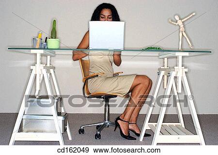 Businesswoman at desk View Large Photo Image Stock Photo - Businesswoman at desk. Fotosearch