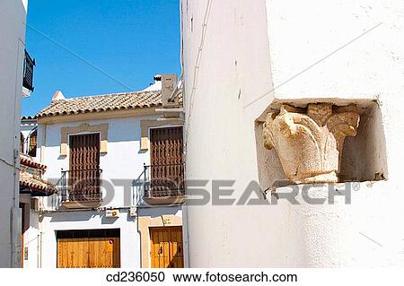 Capital of ancient column revealed in new wall. Cordoba. Andalusia, Spain View Large Photo Image Stock Image - Capital of ancient column revealed in new wall. Cordoba. Andalusia, Spain. Fotosearch