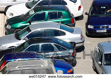 Cars parked in city street View Large Photo Image Stock Photo - Cars parked in city street. Fotosearch