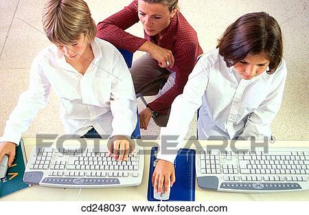 Stock Photo - child, classroom, 30's. Fotosearch