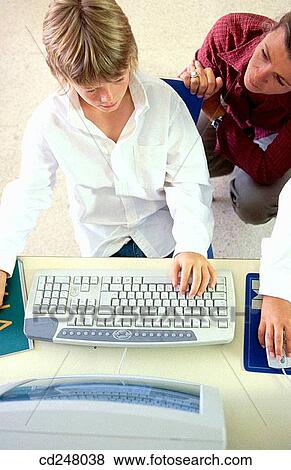 Stock Photo - child, classroom, computer. Fotosearch