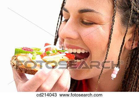 Closeup woman eating toast View Large Photo Image Stock Image - Closeup woman eating toast. Fotosearch