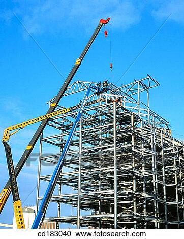 Construction cranes and steel framework, block of offices under construction View Large Photo Image Stock Image - Construction cranes and steel framework, block of offices under construction. Fotosearch