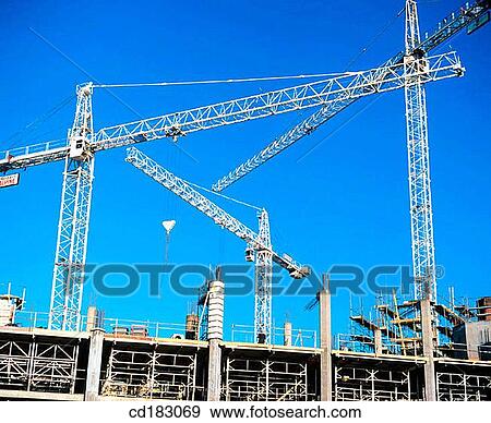 Construction cranes, office block under construction View Large Photo Image Stock Photo - Construction cranes, office block under construction. Fotosearch