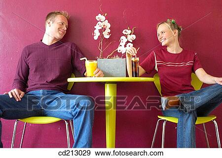Couple drinking in a bar View Large Photo Image Stock Photo - Couple drinking in a bar. Fotosearch