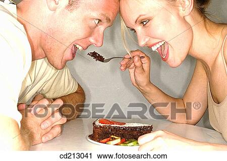Couple eating cake View Large Photo Image Stock Image - Couple eating cake. Fotosearch