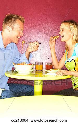 Couple eating View Large Photo Image Picture - Couple eating. Fotosearch