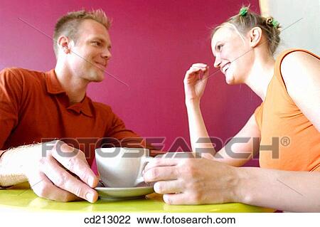 Couple having a coffee View Large Photo Image Stock Image - Couple having a coffee. Fotosearch