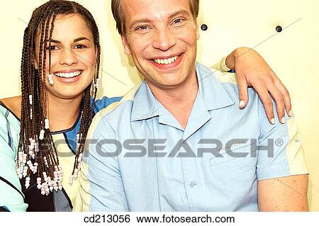 Couple looking at camera View Large Photo Image Stock Photograph - Couple looking at camera. Fotosearch
