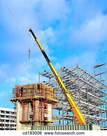 Crane and block of flats under construction View Large Photo Image Stock Photo - Crane and block of flats under construction. Fotosearch