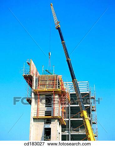 Crane and concrete support for flats View Large Photo Image Stock Photo - Crane and concrete support for flats. Fotosearch