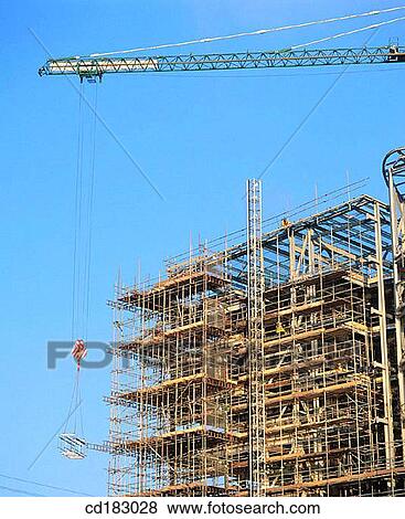 Crane and office block under construction View Large Photo Image Stock Photo - Crane and office block under construction. Fotosearch