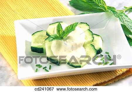 Cucumber salad with yoghurt sauce View Large Photo Image Stock Photo - Cucumber salad with yoghurt sauce. Fotosearch
