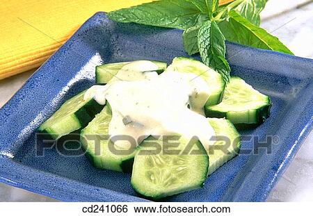 Stock Photograph - Cucumber salad with yoghurt sauce. Fotosearch