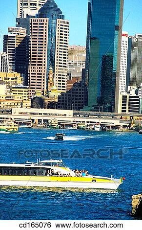 Ferry passing Circuklar Quay and Central Business District, Sydney, Australia View Large Photo Image Stock Photograph - Ferry passing Circuklar Quay and Central Business District, Sydney, Australia. Fotosearch
