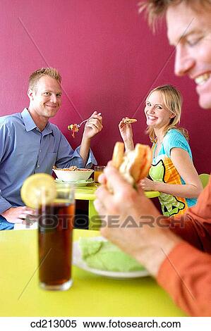 Friends eating View Large Photo Image Stock Photography - Friends eating. Fotosearch