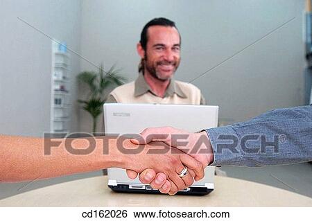 Stock Photograph - Handshaking. Fotosearch